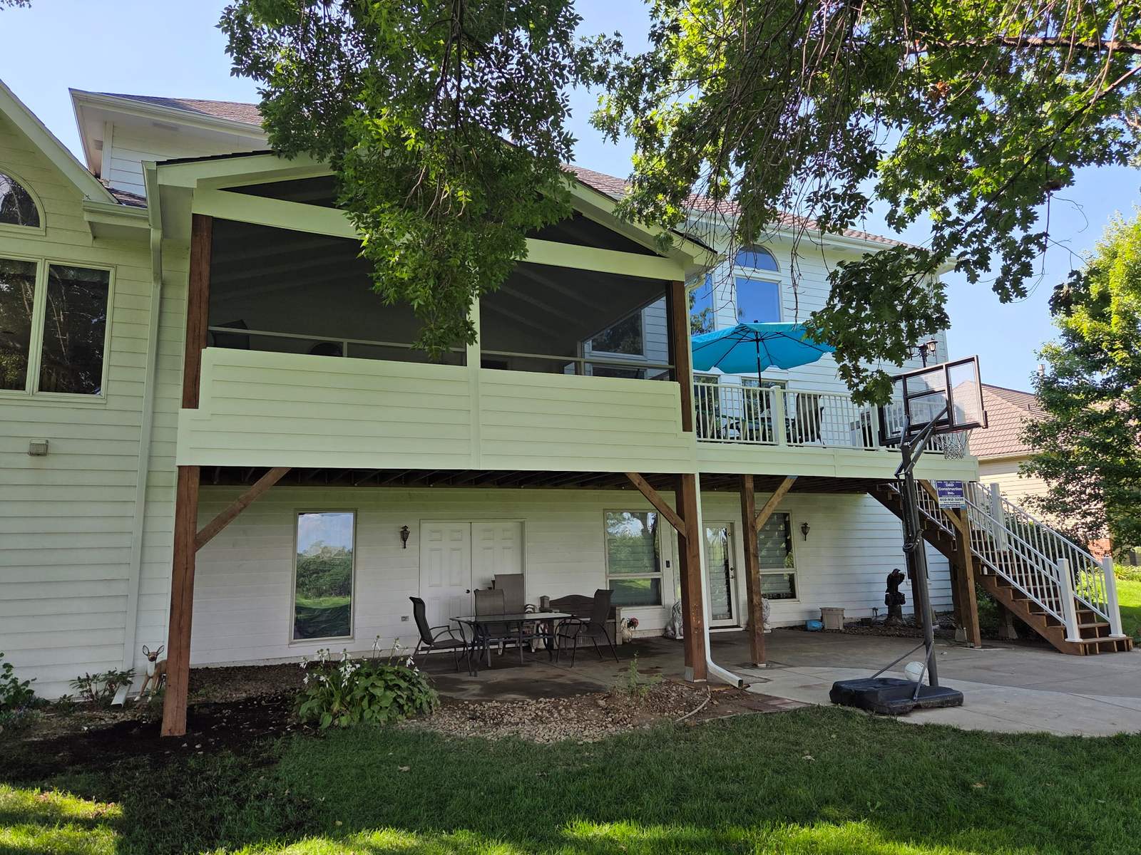 Finished two-storey deck above a screened porch with a cedar ceiling