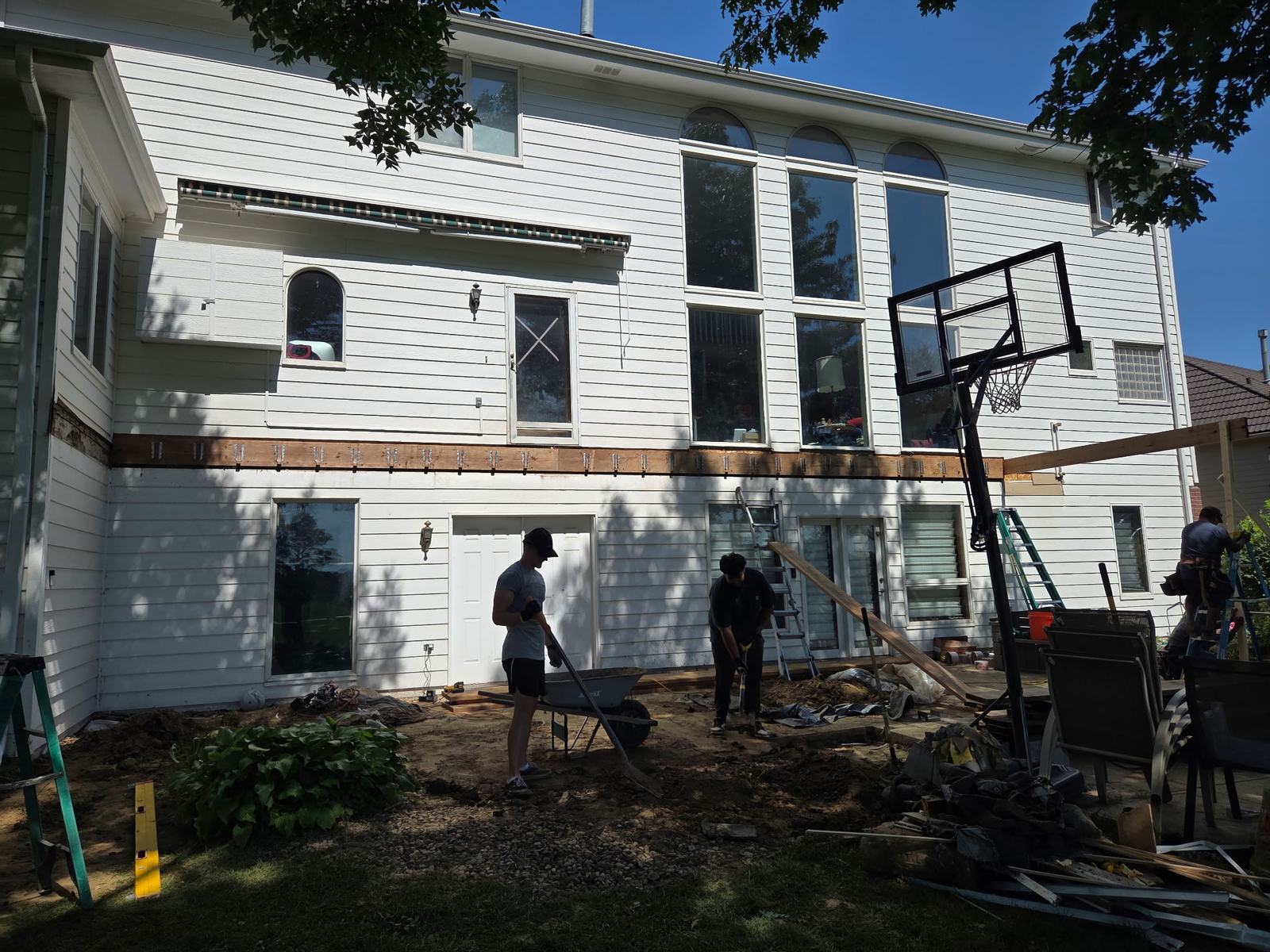 Two-storey deck during construction with new posts and beams going in